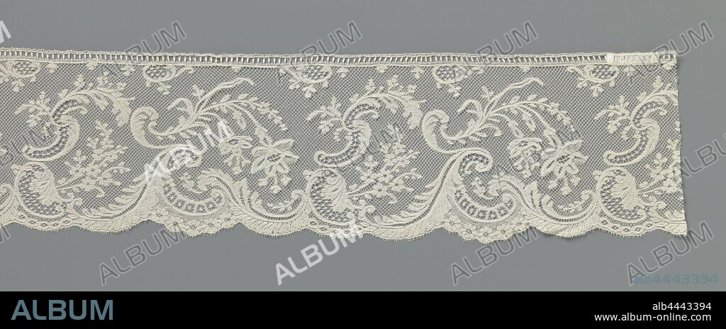 Strip of bobbin lace with fuchsias above skipping waves, Strip of natural-colored bobbin lace, Valenciennes lace. The repeating pattern consists of two fuchsia flowers that hang down on the center line of the strip on a slightly curved stem. The flowers almost touch the wave valley, between the high breaking waves along the bottom of the strip. The waves are made of feathered leaves and acanthus leaves placed against each other, in the form of c and s volutes. Between the fuchsia branches a bouquet with rosette flowers originates from a c-volute, crowned by an open-worked s-volute of leaves and twigs. The motifs are connected by a mesh ground, a diamond-shaped Valenciennes ground. The full work is largely made in linen stroke with cut-outs and openwork edges and partly in net stroke. Snowflakes and loose snowflakes were used as ornamental ground. The top of the strip is finished with a separately clotted strap. The scallops along the bottom are finished with picots., anonymous, Belgium, c. 1890, cotton (textile), Valenciennes lace, l 75 cm × w 10.5 cm ×, 16.3 cm.