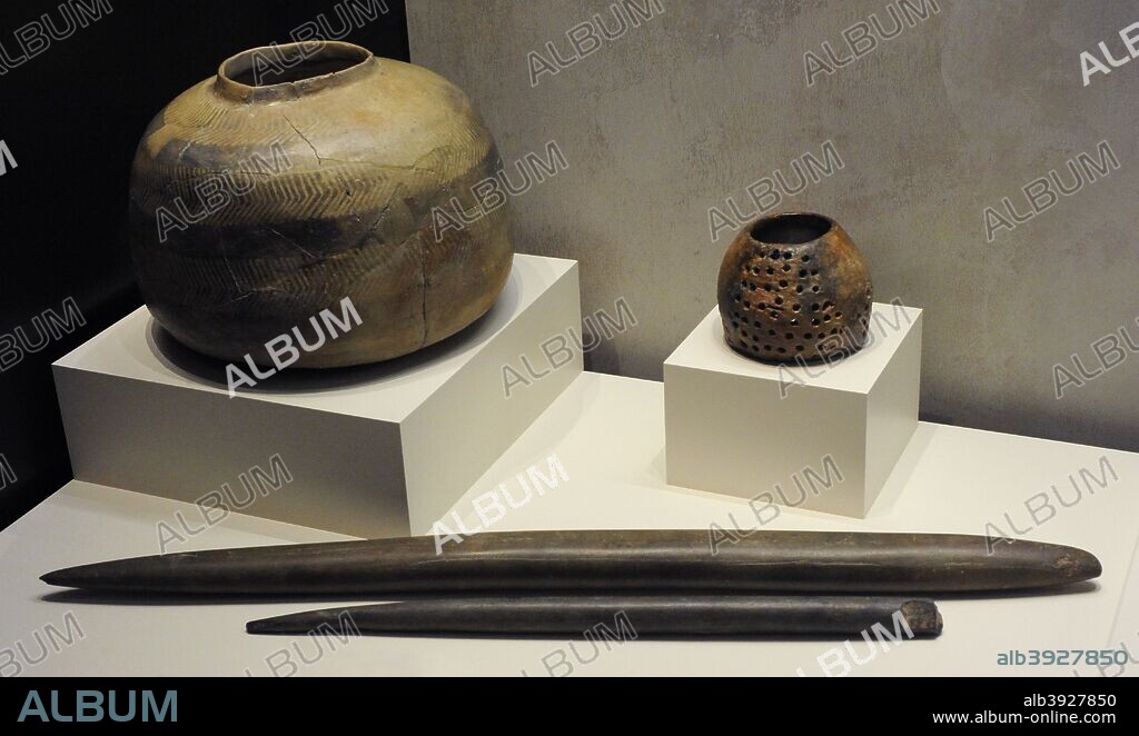 Bottle. Chalcolithic period. 2500-2000 BC. El Tarajal (Nijar, province of Almeria, Andalusia); Cheese pot. Chalcolithic period. Gozquez, San Martin de la Vega, Community of Madrid. Deposit of the Regional Archaeological Museum of Alcala de Henares and Ploughshares (first). Neolithic period. Malaquintos Hill (Corral de Calatrava, province of Ciudad Real, Castile-La Mancha). National Archaeological Museum. Madrid. Spain.