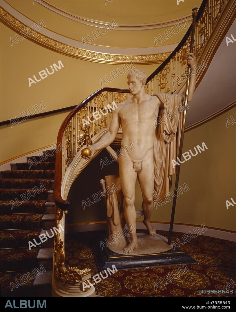 Statue of Napoleon as Mars the Peacemaker, Apsley House, London. Interior view of the principal staircase of Apsley House with  the statue of Napoleon holding a figure of Victory by Antonio Canova. The statue was originally commissioned from the celebrated Italian sculptor by Napoleon himself. In 1816, after Napoleon's downfall, it was presented to the 1st Duke of Wellington by the Prince Regent (later George IV).