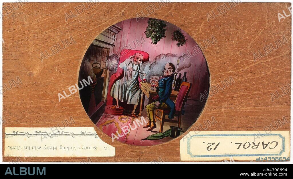 Lantern Slide - A Christmas Carol, 'Scrooge Making Merry with his Clerk', 1843-1880, Number 12 in a set of twelve slides in the series 'A Christmas Carol'. 'A Christmas Carol' is a novella by English author Charles Dickens. It was first published by Chapman and Hall on 19 December 1843. The story tells of sour and stingy Ebenezer Scrooge's ideological, ethical, and emotional transformation after the supernatural visitations of Jacob Marley and the Ghosts of Christmas Past,.