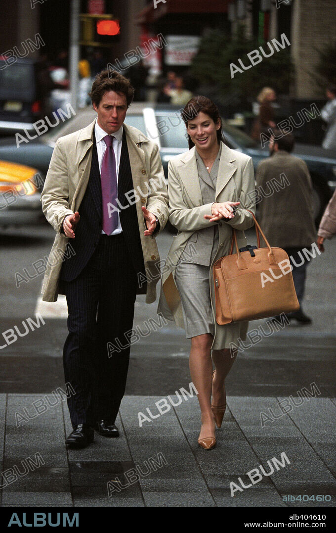 HUGH GRANT y SANDRA BULLOCK en AMOR CON PREAVISO, 2002 (TWO WEEKS NOTICE), dirigida por MARC LAWRENCE. Copyright WARNER BROS. PICTURES.