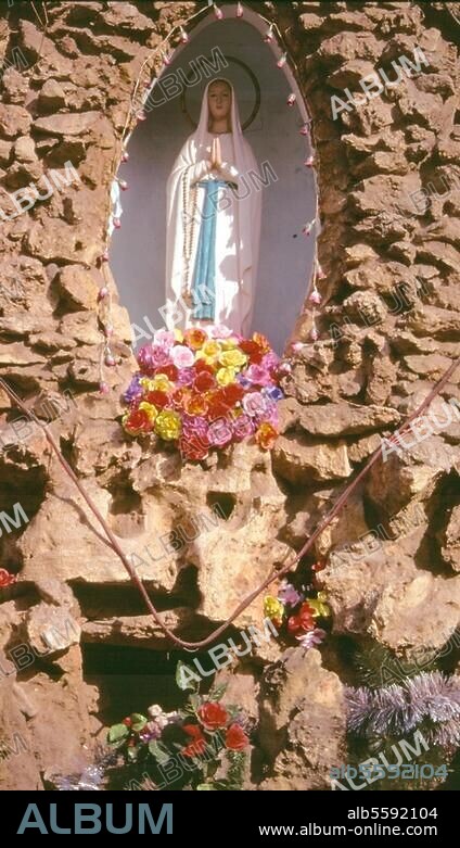 Beijing - Peking (China), North Cathedral - Bei Tang. (built 1889). Statue of the Virgin Mary in the grotto in front of the cathedral. Photo, undat.