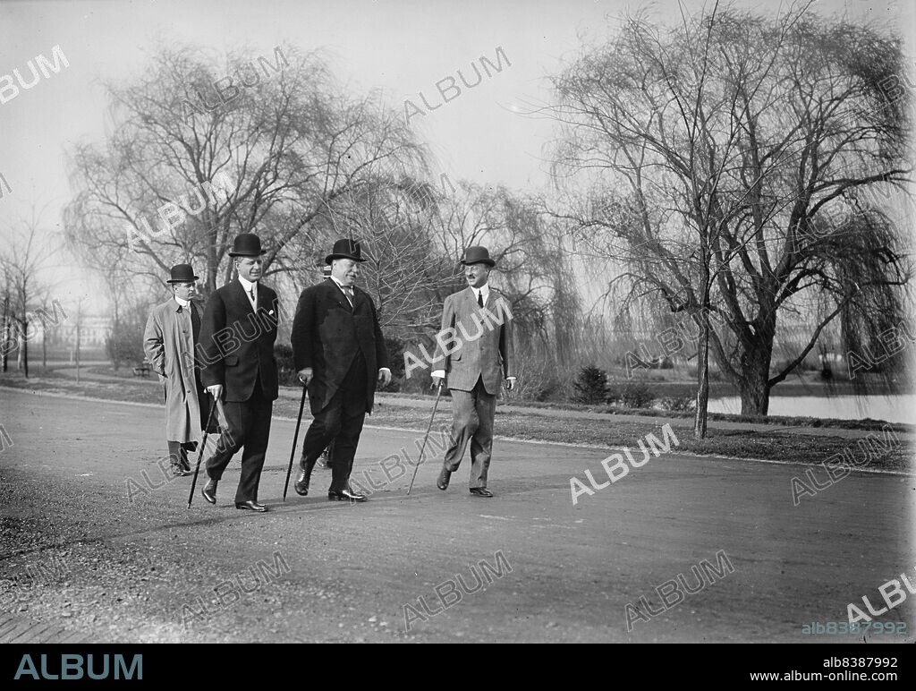 HARRIS & EWING. William Howard Taft Out For A Stroll with Archibald Butt, Military Aide, And Charles Dewey Hilles, Secretary To The President, 1910. [US President (centre) with Hilles (2nd left) and Butt (right)].