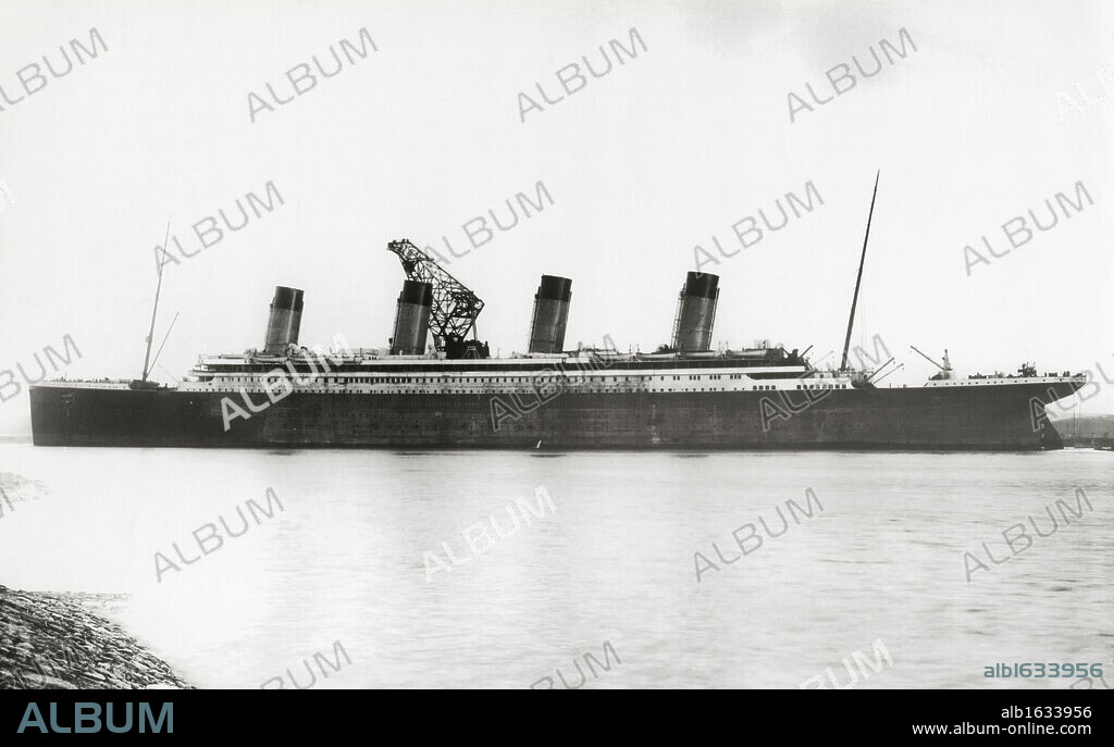 RMS Titanic nearing completion. RMS Titanic Nearing Completion, 01/08/1912. The White Liner, built by Harland & Wolff in Belfast, left Southampton and Cherbourg on her maiden voyage to New York on April 10th 1912. The steamship sank on April 15th 1912 off the coast of New Foundland after striking an iceberg with the loss of 1,635 passengers and crew. (Photo by Titanic Images/Universal Images Group).