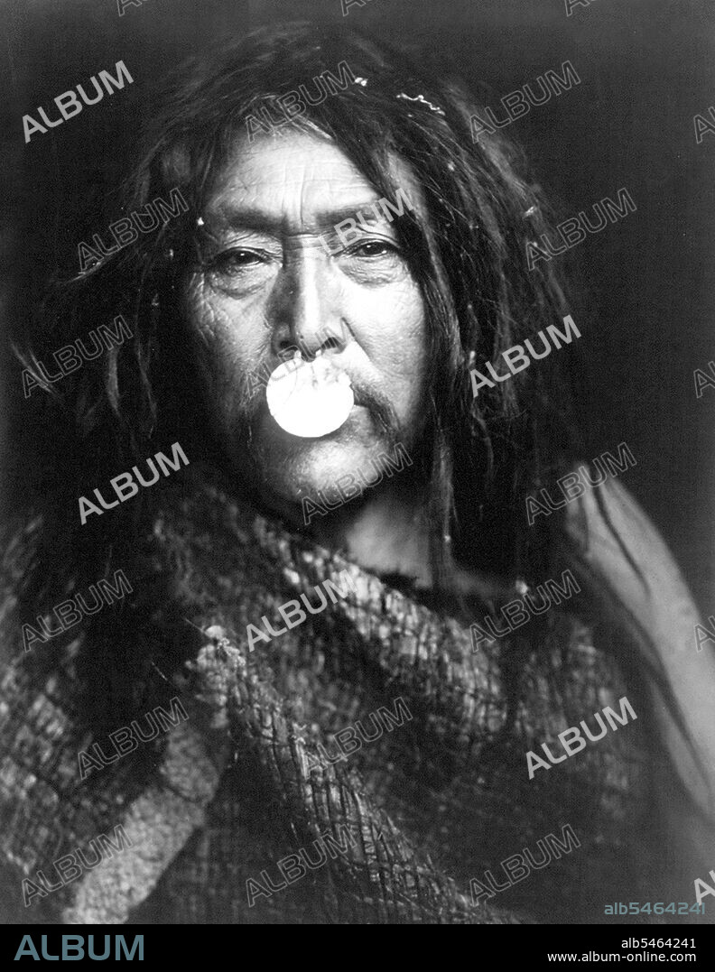 Edward S. Curits Native American Indians - Naemahlpunkuma, a Hahuamis man, wearing a nose ornament that covers his mouth circa 1914.