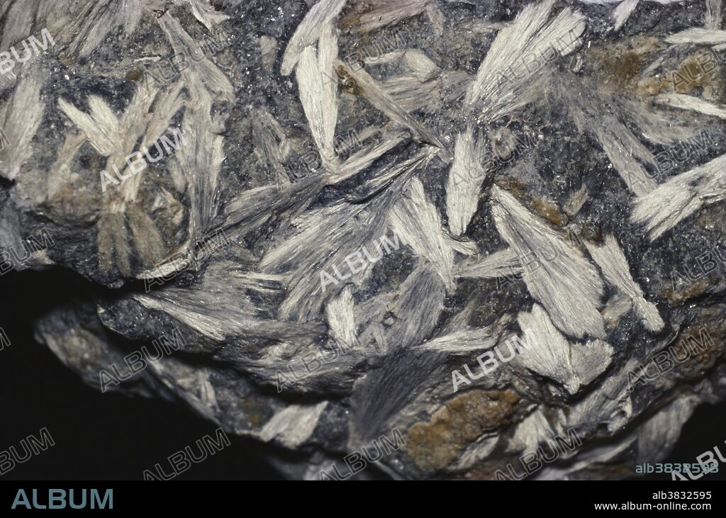 Anthophyllite, a silicate mineral formed in metamorphosed magnesium-rich rocks.  Fibrous anthophyllite can be used as asbestos.