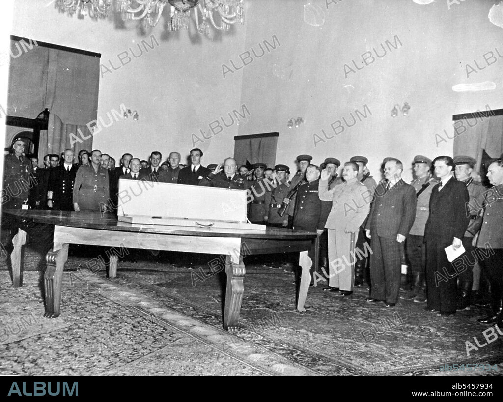 The Sword of Stalingrad, gift of the King, to the citizens of Stalingrad in token of the homage of the British people, was handed over to Marshal Stalin by Mr. Winston Churchill at a ceremony held in the Russian Embassy at Tehran, during the Tripartite Conference. Marshal Stalin and the Premier saluting during the play of the Allied. National Anthems. The Sword is lying in its case upon the table. 
During the Teheran Conference, Mr. Churchill presented the Stalingrad sword to Marshal Stalin. December 7, 1943. (Photo by British Official Photograph).