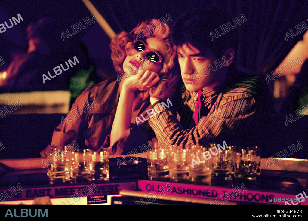 BRIGITTE LIN and TAKESHI KANESHIRO in CHUNGKING EXPRESS, 1994 (CHUNG HING SAM LAM), directed by KAR-WAI WONG. Copyright JET TONE PRODUCTION.