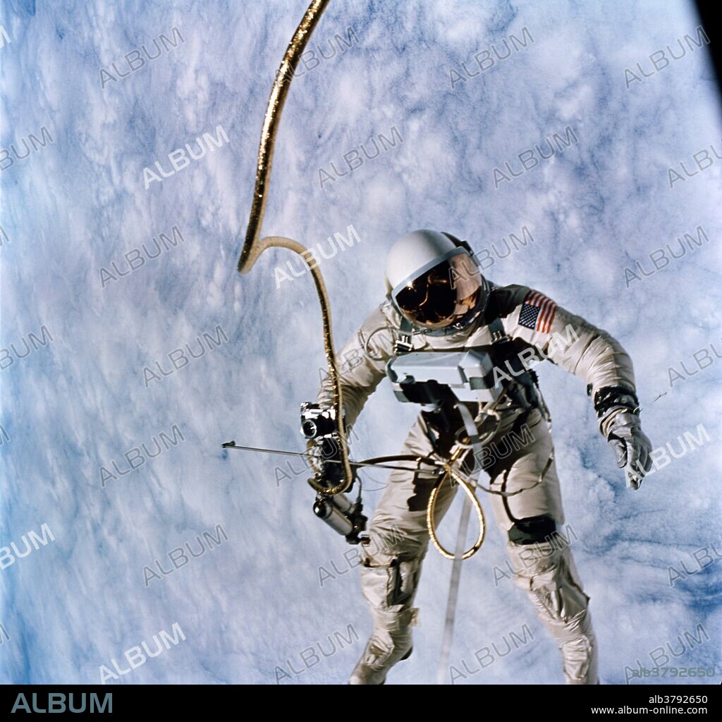 Astronaut Edward H. White II, pilot for the Gemini-Titan 4 (GT-4) spaceflight, floats in the zero-gravity of space during the third revolution of the GT-4 spacecraft. White wears a specially designed spacesuit. His face is shaded by a gold-plated visor to protect him from unfiltered rays of the sun. In his right hand he carries a Hand-Held Self-Maneuvering Unit (HHSMU) that gives him control over his movements in space. White also wears an emergency oxygen chest pack; and he carries a camera mounted on the HHSMU for taking pictures of the sky, Earth and the GT-4 spacecraft. He is secured to the spacecraft by a 25 feet umbilical line and a 23 feet tether line. Both lines are wrapped together in gold tape to form one cord. Astronaut James A. McDivitt, command pilot, remained inside the spacecraft during the extravehicular activity (EVA).