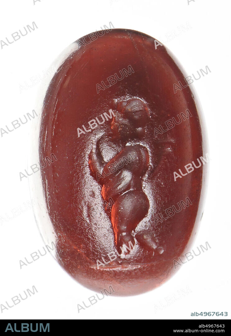 Vz: the chubby, naked child has his hair in a roll around his head and a small knot in his neck, his left arm is raised to his lips, behind his shoulder a cornucopia., Gem, intaglio, ringstone, garnet, Color: deep pink red, Shape: oval, Machined: Maaskant-Kleibrink, M., Catalog of the engraved gems in the Royal Coin Cabinet, 1978, p.60, fig.2, type F8, front convex, rear light concave, Method: deep body modeling with very, 13.5 x 9 mm, D. 4 mm, 2nd - 1st century BC. -200.