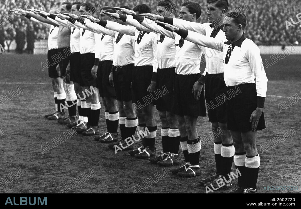 1936, Germany Versus England. German team give the Nazi salute at the Berlin Olympic games.