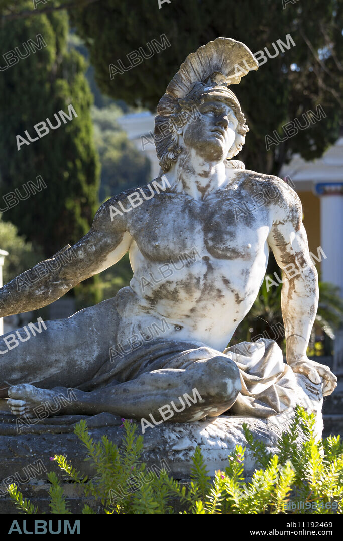 Stone statue of reclining figure of Dying Achilles (Achilleas thniskon) at Achilleion Palace, Museo Achilleio, in Corfu, Greek Islands, Greee, Europe.