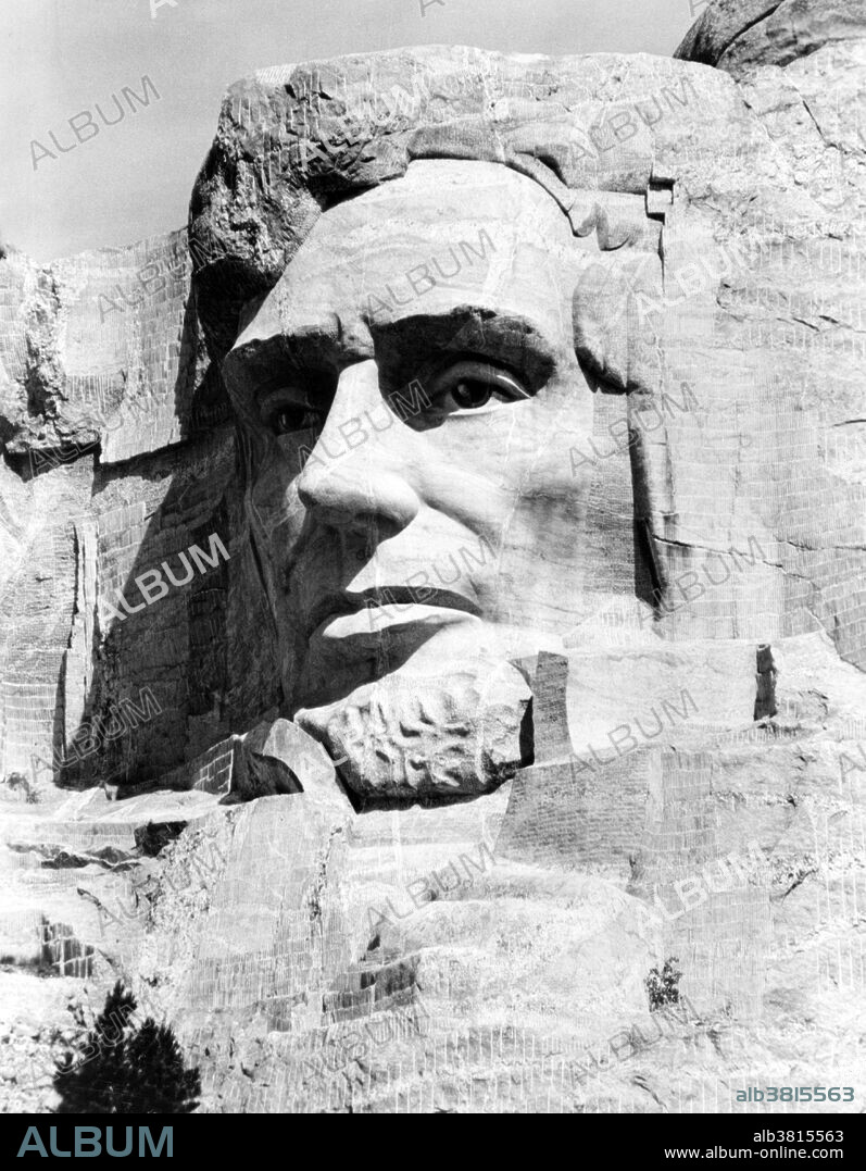 Abraham Lincoln's head was the most challenging because of his beard, but his head was completed on the far right of the cliff. Dedicated on September 17, 1937, it took 2 days, which was the 150th anniversary of the signing of the Constitution of the United States in 1787. Mount Rushmore National Memorial is a sculpture carved into the granite face of Mount Rushmore near Keystone, South Dakota. Sculpted by Danish-American Gutzon Borglum and his son, Lincoln Borglum, Mount Rushmore features 60 foot sculptures of the heads of four United States presidents: George Washington, Thomas Jefferson, Theodore Roosevelt, and Abraham Lincoln. Construction on the memorial began in 1927, and the presidents' faces were completed between 1934 and 1939. Although the initial concept called for each president to be depicted from head to waist, lack of funding forced construction to end in late October 1941. Mount Rushmore has become an iconic symbol of the United States, and attracts over three million people annually. NPS, no photographer credited, undated.
