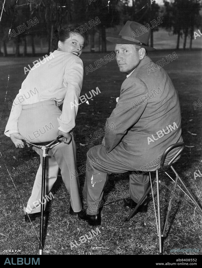 Pause that refreshes... Spencer Tracy and Katharine Hepburn take time out between scenes of their latest M-G-M comedy, "Pat and Mike". Directed by George Cukor. Produced by Lawrence Weingarten. Written by Ruth Gordon and Garson Kanin. September 06, 1952.
