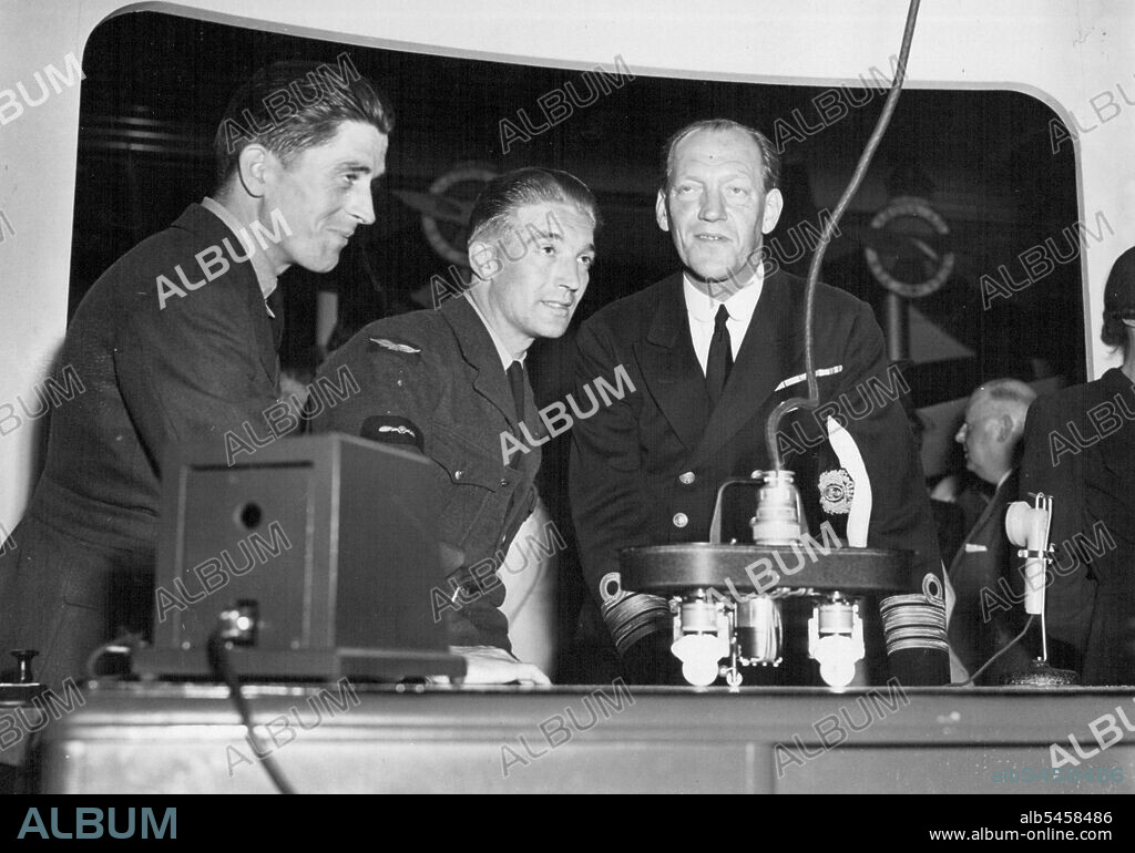 Picture Shows: Prince Axel of Denmark, who is an Ex-Pilot, operates the link trainer, assisted by leading Atrcraftmen V. Nichols, R.A.F., electrician of Caerphilly, S. Wales and a Danish pilot, Waeeant Officer J. Ipsen of S. Jutland.Danish Royalty at R.A.F. Exhibition, Copenhagen.Prince Axel of Denmark Opened the R.A.F. Exhibition on June 23rd., at a leading Danish store in Copenhagen. Present at the ceremony was Air Marshal Sir Arthur Coningham, K.C.B., D.S.O., M.C., D.F.C., A.F.C. Twelve members of the Danish royal Family members of the resistance movement and ministers were among the guests. The W.A.A.F. band led the royal procession to the opening of the exhibition through the Copenhagen streets, where they were given a warm reception. This is the first time W.A.A.F. band has left England. September 10, 1945.