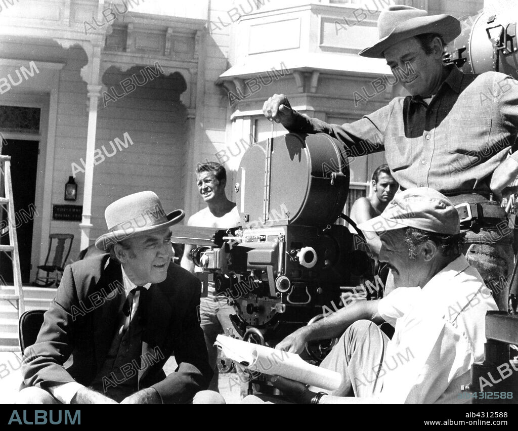 GENE KELLY, HENRY FONDA and JAMES STEWART in THE CHEYENNE SOCIAL CLUB, 1970, directed by GENE KELLY. Copyright NATIONAL GENERAL PICTURES.