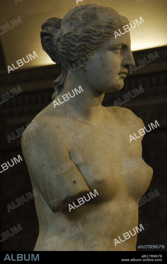 Greek Art. Statue of Aphrodite of Milos, known as the Venus de Milo (130-100 B.C.) by Alexandros of Antioch. Marble. It is believed to depict the Greek goddess of love and beauty, Aphrodite. Three-quarter view. Detail. Louvre Museum. Paris. France.
