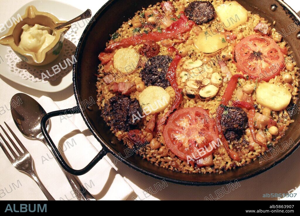 Puente Arce; restaurante "EL Redoble"; paella de Arroz Al horno.