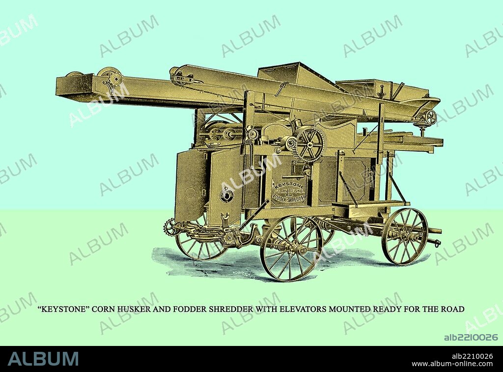 "Keystone" Corn Husker and Fodder Shredder with Elevators Mounted and Ready for the Road.