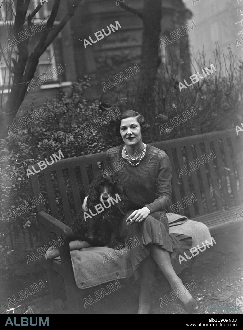 London bride for Scottish baronet . Sir Torquil Munro , the 31 year old Scottish baronet , is engaged to be married to Miss Moira Hunter , daughter of Mr K O Hunter of Cadogan Gardens , London . Sir Torquil has seats at Lindertis and Drumleys , Kirriemuir . Miss Moira Hunter photographed with her pet parrot in her London home after the announcement of the engagement . 2 November 1932.