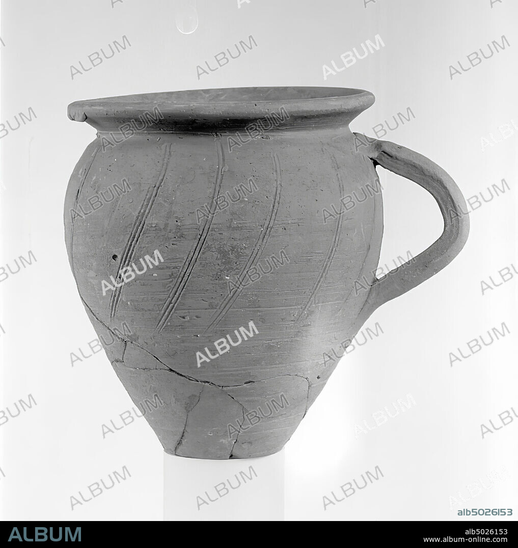 Roman thin-walled true ovoid beaker. Roman thin-walled true mug or cup., Vase, mug, cup, pottery, Roman, thin-walled ware, 9 cm, late Roman, Tunisia.