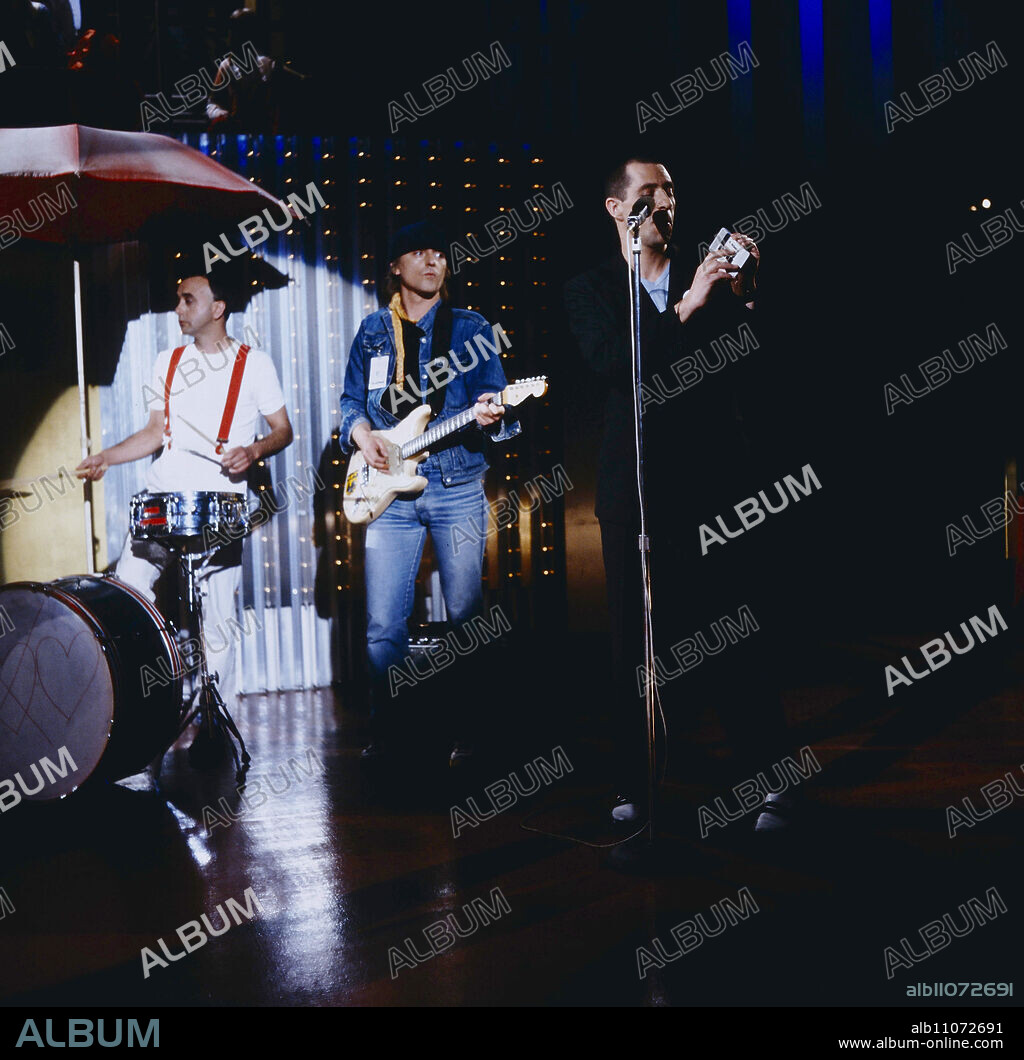 ZDF Hitparade, music show, 1st appearance of Trio, German band, in the picture: drummer Peter Behrens, guitarist Kralle Krawinkel and Stephan Remmler with toy keyboard Casio, he sings the hit: DA Da Da I don't love you, you don't love me, Germany, 1982.