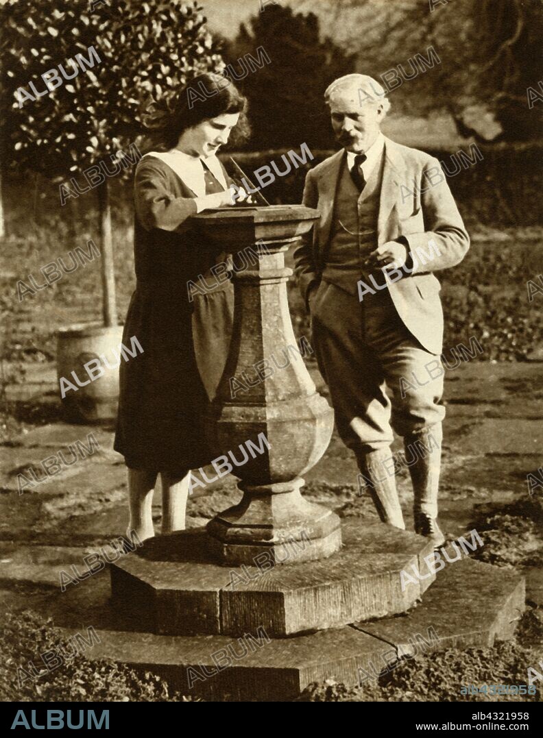 Ramsay MacDonald, first Labour Prime Minister, at Chequers with his his daughter, 1924, (1935). British politician James Ramsay MacDonald (1866-1937) with his daughter Sheila (1910-1994) in the garden at the prime minister's country retreat in Berkshire. From "The Silver Jubilee Book - The Story of 25 Eventful Years in Pictures". [Odhams Press Ltd., London, 1935].