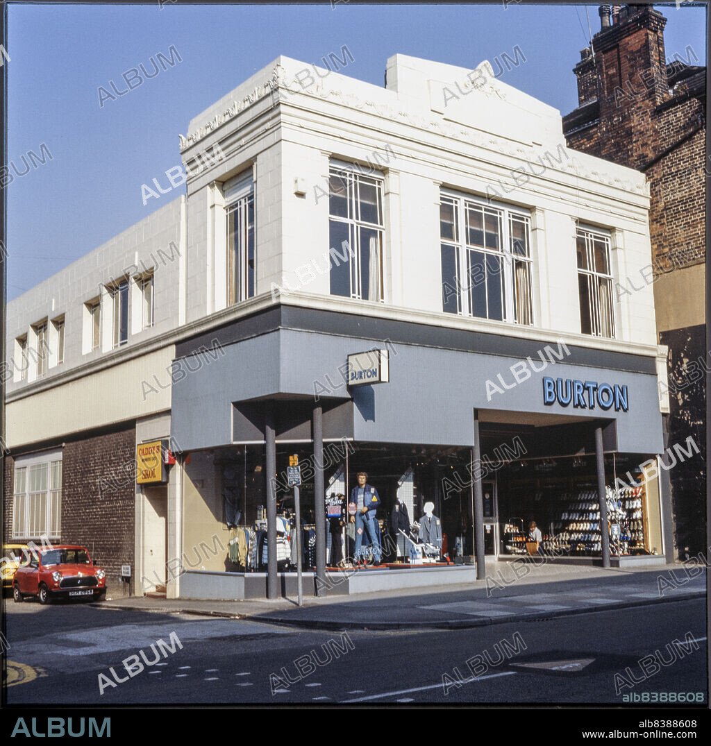 NICHOLAS ANTHONY JOHN PHILPOT. Burton, 27-29 Market Street, Longton, Stoke-on-Trent, City of Stoke-on-Trent, 1980s-1990s. The Burton store at 27-29 Market Street, seen from the west. The store closed as a Burton and Dorothy Perkins in 2020/2021.