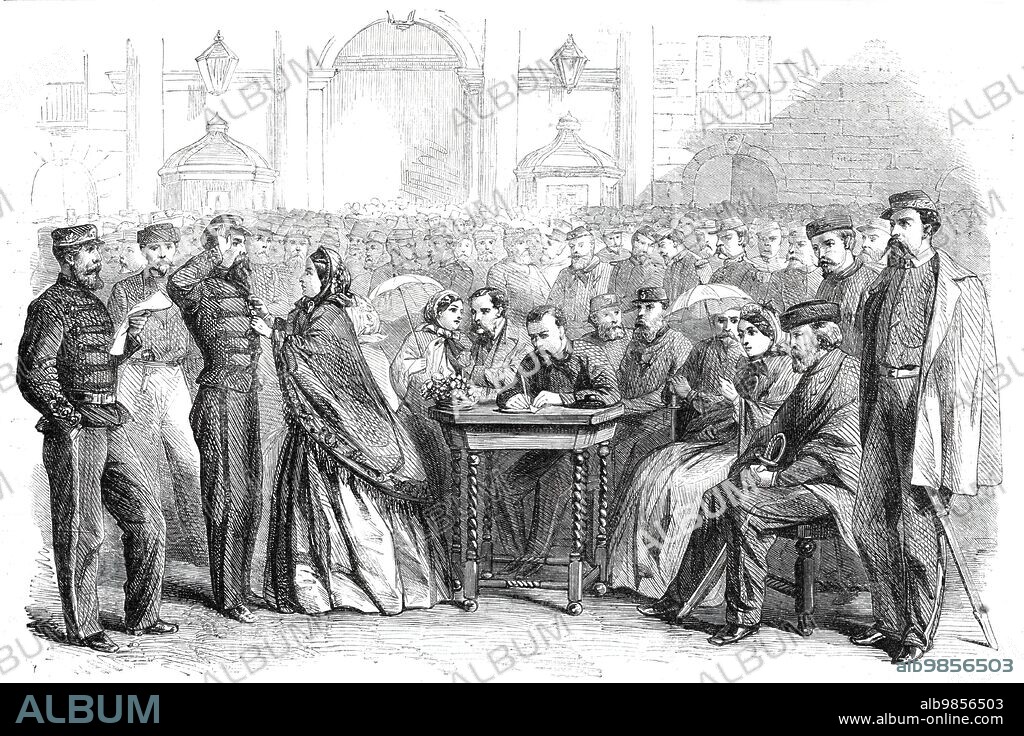 Presentation of medals to Garibaldi's veterans in the Grand Square, Naples, 1860. Italian soldiers are decorated. 'Nearly the last act of Garibaldi, before closing his career, for the time, in Italy was to assist at the ceremony of presenting the commemorative medal to the chosen band that landed with him at Marsala on the 11th of May last. They mustered on that day 1080, but of these only 426 survived to receive the decoration. The presentation took place in the Largo del Palazzo on the 4th November. The Hungarian cavalry, a noble-looking set of fellows, were in front of the palace. There were red-jackets, too, on the three sides of the square, and nearly in the centre was seated Garibaldi, together with a number of ladies of high rank, and the deputation from the municipality of Palermo, all on painted chairs, whilst two or three common wooden tables placed before them bear all the trays full of medals, and another the register of the names...As they were called the men came up through two files of their countrymen, and the Duchess Verdura pinned on a medal to their breasts'. From "Illustrated London News", 1860.