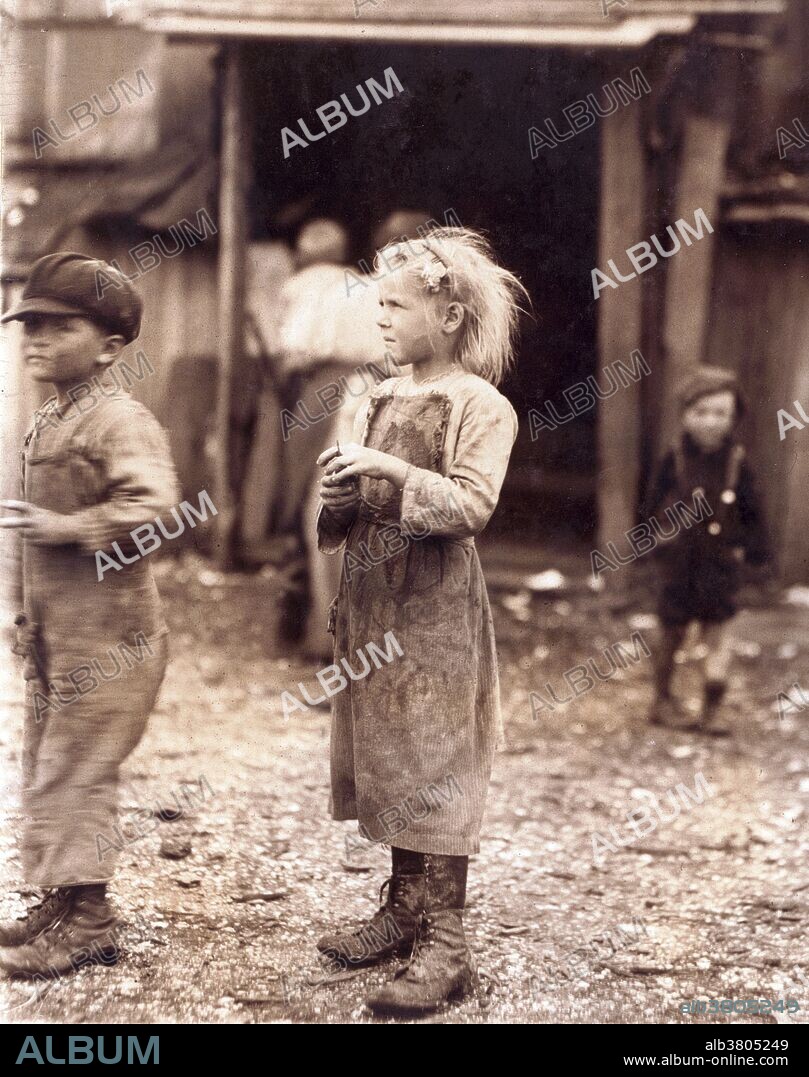 Entitled: "Bertha, one of the six-year old shuckers. Began work at 4 A.M. Maggioni Canning Co. Location: Port Royal, South Carolina.." Child labor refers to the employment of children in any work that deprives children of their childhood, interferes with their ability to attend regular school, and that is mentally, physically, socially or morally dangerous and harmful. According to the 1900 US Census about 1 in every 6 Children between the ages of five and ten were engaged in "gainful occupations" in the United States. This trend alarmed Americans who, while supporting the traditional role of children in agriculture, found the idea of American youth laboring for meager wages in industrial factories appalling. From 1909 to 1921 the NCLC (National Child Labor Committee) capitalized on this moral outrage by making it the focal point of the NCLC campaign against child labor. They hired Lewis Hine, a teacher and professional photographer trained in sociology, to document child labor in American industry. Over the next ten years Hine would publish thousands of photographs designed to pull at the nation's heartstrings. Photographed by Lewis Hine, Febraury 1912.