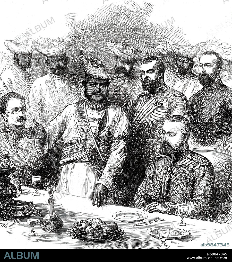 The Royal Visit to India: Scindia proposing the health of the Prince of Wales at Gwalior, from a sketch by one of our special artists, 1876. The future King Edward VII attends a banquet. '...the Maharajah Scindia entered and sat beside the Prince, ten of his nobles being ranged beside him. He proposed the health of the Queen, and subsequently that of the Prince, which was drunk in champagne. The Prince, in very warm terms, returned thanks and gave the health of Scindia, whom he should ever remember as a friend. The toast was drunk...amid loud cheers. The great Mahratta chief appeared immensely gratified. Our Illustration of the scene at table shows the Maharajah...the Prince of Wales seated at his left hand and Sir Bartle Frere on his right. Behind Scindia...stands Sir Richard Daly, who interprets to the Prince of Wales the speech of his generous Indian host'. From "Illustrated London News", 1876.
