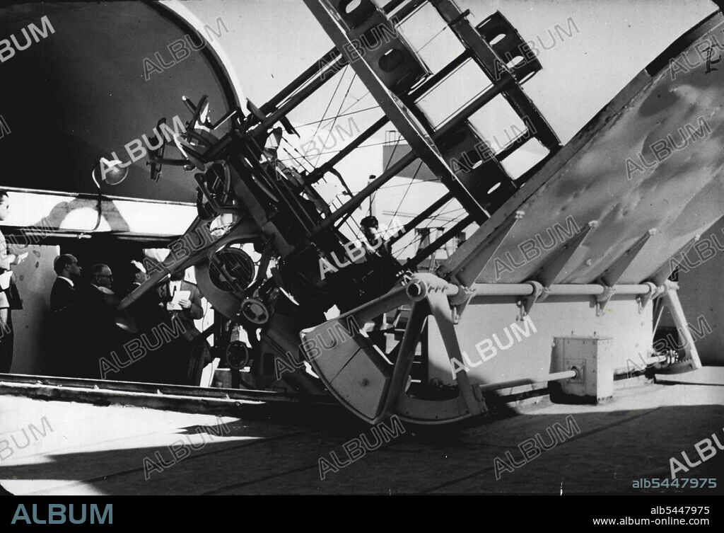 This Californian solar furnace uses giant lenses to direct the sun's rays into a central chamber. The heat is enough to melt metal. The movable mounting keeps the sun in focus. February 13, 1955.