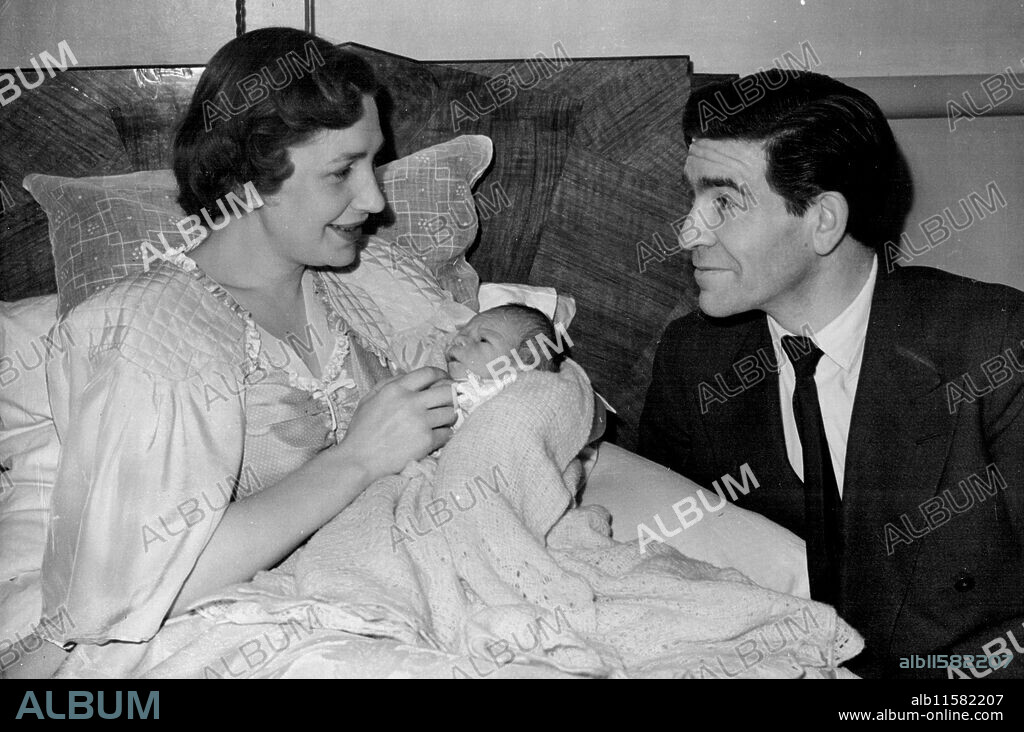 ' Extra ' With A Leading Role - This happy family gathering is in a London nursing home as 38-year-old Canadian film, stage and radio actor Robert Beatty visits his wife and their infant son, Born on March 25, the baby arrived a month early, weighting 5 pounds 10 ounces. His father already has film ambitions for him - to be realised as soon as he is old enough to play baby parts. Mr. and Mrs. Beatty were married in 1945 after a B.B.C. romance. Mrs. Beatty - then Dorothy Steele-worked in one of the B.B.C. gramophone libraries. April 03, 1949.