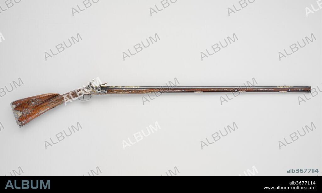 Flintlock Gun. Barrelsmith: Le Faure (French, Paris, active ca. 1750-90). Culture: French, Paris. Dimensions: L. 58 in. (147.3 cm). Gunsmith: Mollier (French, Paris, active ca. 1750). Date: ca. 1750.
This slender and elegant gun represents the great refinement of form, design, and function achieved by French gunmakers in the eighteenth century and emulated across Europe. The delicate silver wire inlays of its stock are based on French pattern books from 1705, while the carved and chiseled ornament of the stock, lock, and other fittings shows a wide range of Rococo motifs drawn from designs published as late as the 1740s.