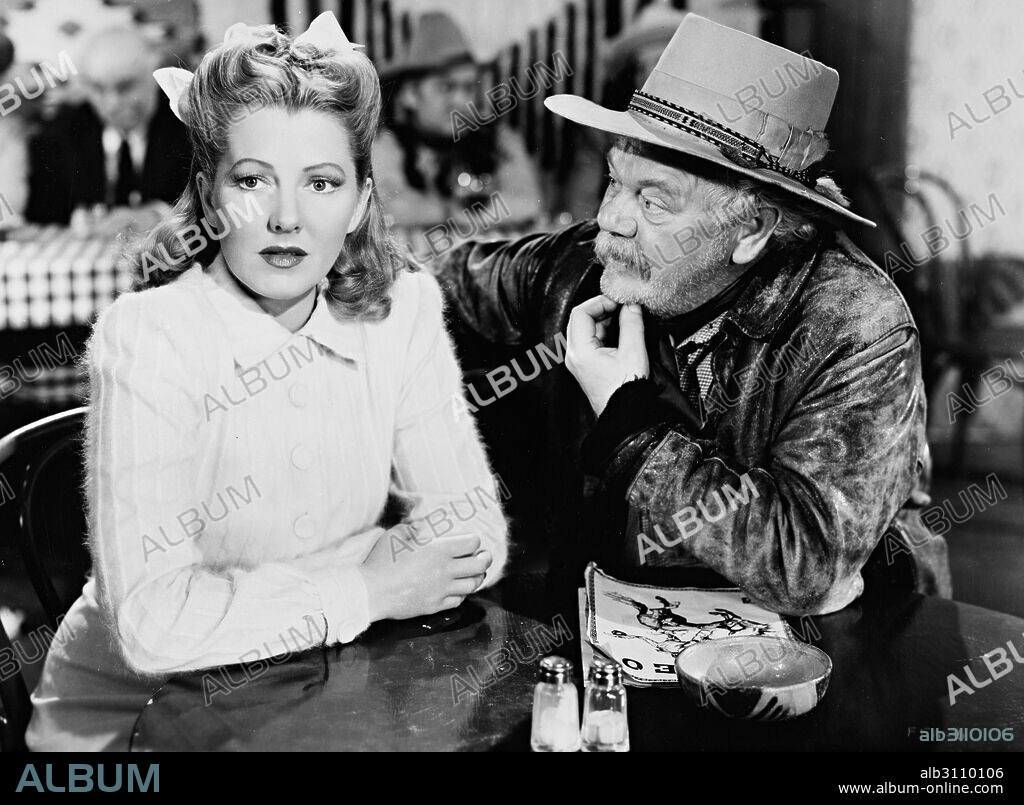 CHARLES WINNINGER and JEAN ARTHUR in A LADY TAKES A CHANCE, 1943, directed by WILLIAM A. SEITER. Copyright RKO.