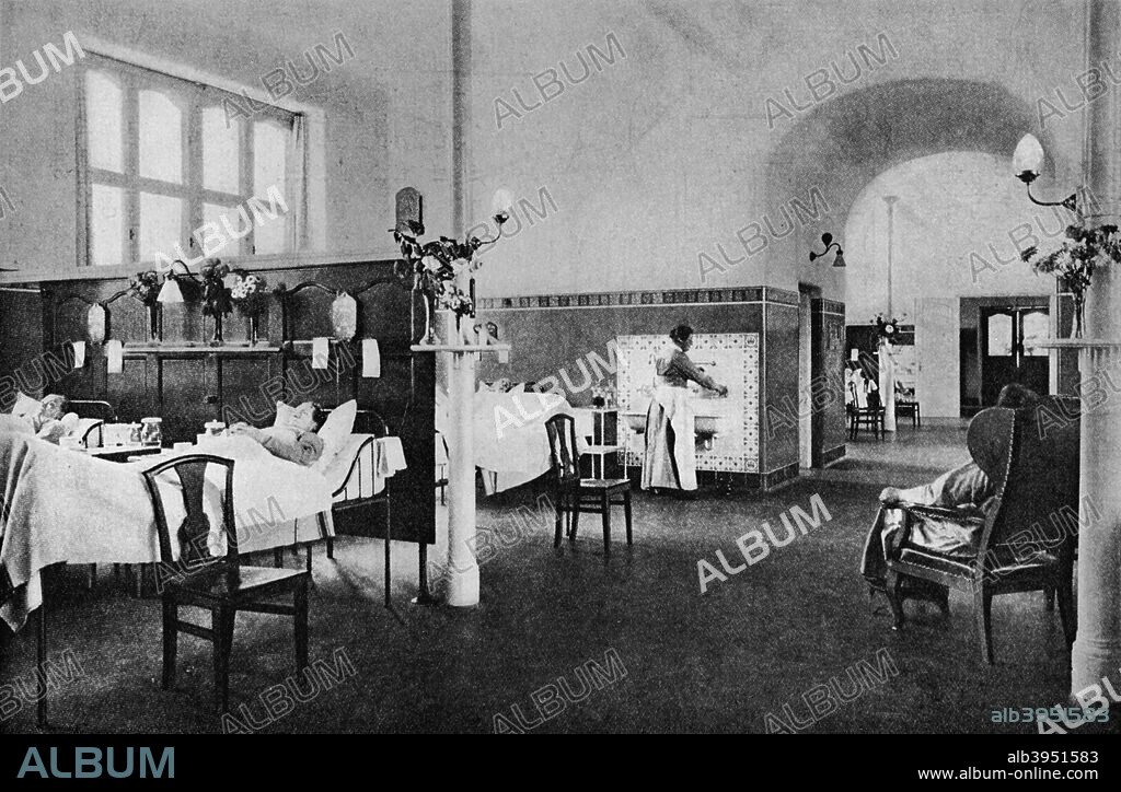 Interior of a ward in the Rigshospitalet (National Hospital), Copenhagen, Denmark, 1922. View showing the division of the space into alcoves by screens. From The Architectural Forum Volume XXXVII. [Rogers and Manson, New York, 1922].