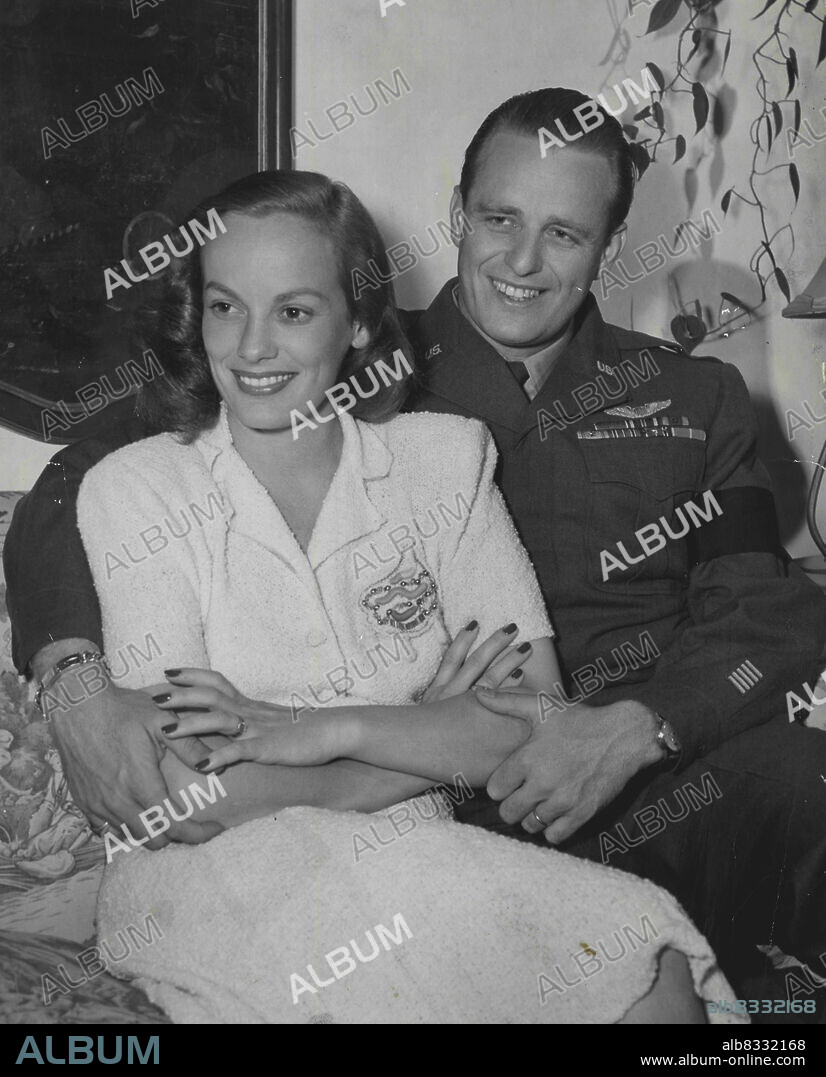 Mrs Faye Emerson Roosevelt and her husband, Brig. General Elliott Roosevelt, pose for the press in their new Beverly Hills home. Faye is currently being seen in the Warner Bros. picture, "Hotel Berlin." December 31, 1946. (Photo by Warner Bros.).