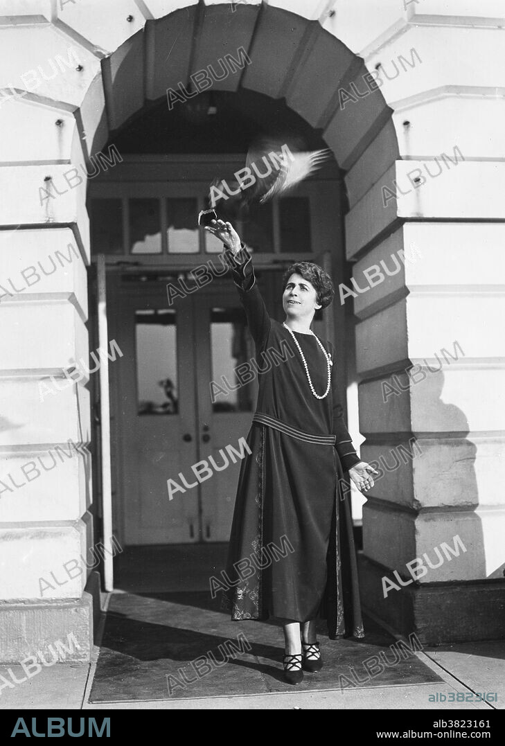 Grace Coolidge and bird. White House, Washington, D.C. Grace Anna Goodhue Coolidge (January 3, 1879 - July 8, 1957) was First Lady from 1923-29. She graduated from the University of Vermont in 1902 and then joined the faculty of the Clarke School for the Deaf in Northampton, Massachusetts, as a lip reading instructor. She married Calvin Coolidge in 1905. She took her part in town activities, attended her church, and offset his shyness with a cheery friendliness. As First Lady, she was a popular hostess. The Coolidges were a particularly devoted couple, although the president never discussed state matters with her. Coolidge summed up his marriage to Grace in his autobiography: "For almost a quarter of a century she has borne with my infirmities, and I have rejoiced in her graces." After her husband's death, she continued her work on behalf of the deaf. She was also active in the Red Cross, civil defense, and scrap drives during WWII. She kept her sense of fun and her aversion to publicity until her death in 1957 at the age of 78. Photographed by Harris & Ewing, 1923.