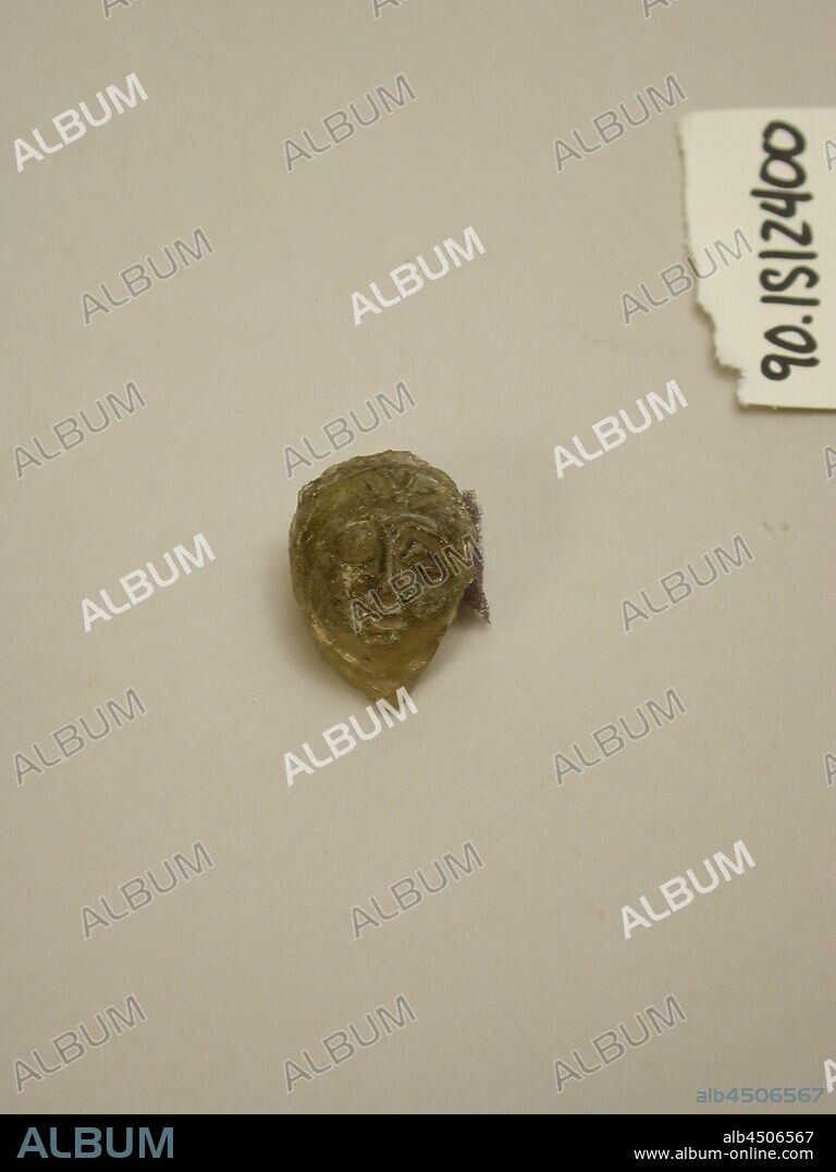 Roman, Fragment of a Medallion from a Glass Vessel, 4th/5th Century AD, Cast or molded glass, H. 1 1/4 x W. 7/8 x Th. 5/8 in.