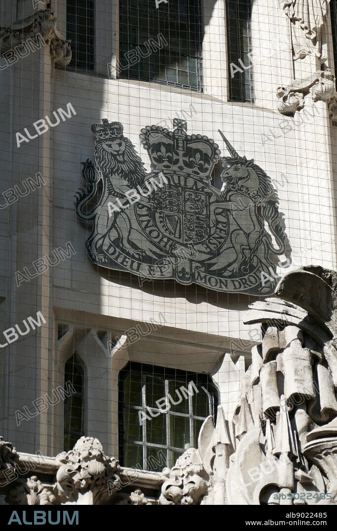 Royal crest outside the Supreme Court, London. The Court is the final court of appeal in the United Kingdom. Dieu et mon Droit (God and my right), is the motto of the Monarch of the United Kingdom, outside Scotland. It appears on a scroll beneath the shield of the version of the coat of arms of the United Kingdom.