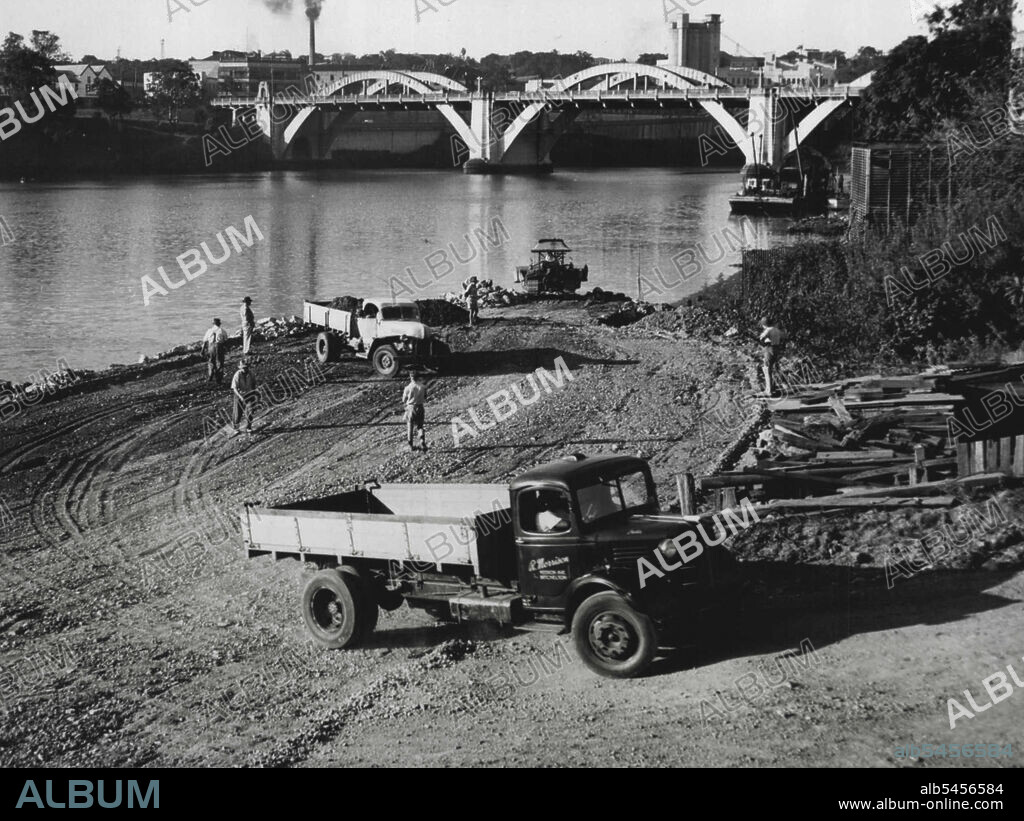 Foundations for the new Riverside Drive on the south bank of the Milton reach of the Brisbane River. hundreds of tons of rock and rubble are being dumped beyond the low water mark. January 01, 1951.