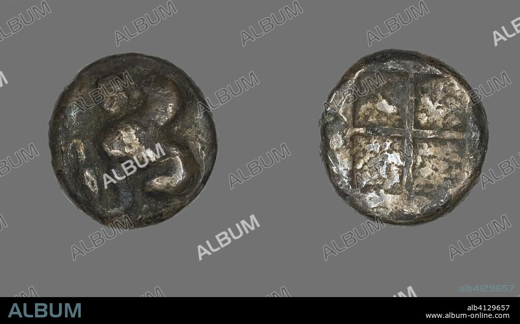 ANCIENT GREEK. Drachma (Coin) Depicting a Sphinx. Greek. Date: 478 BC-412 BC. Dimensions: Diam. 1.3 cm; 2.82 g. Silver. Origin: Greece.