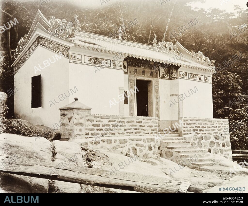 Hong KongChina, Exterior view of a small Joss house (Chinese temple) in Shau Kei Wan. Illustrated panels decorate the eaves beneath the building's ornate roof.Original manuscript caption: New Joss House. Shau-Ki Wan. Hong Kong, circa 1905. 1998/028/1/1/45.