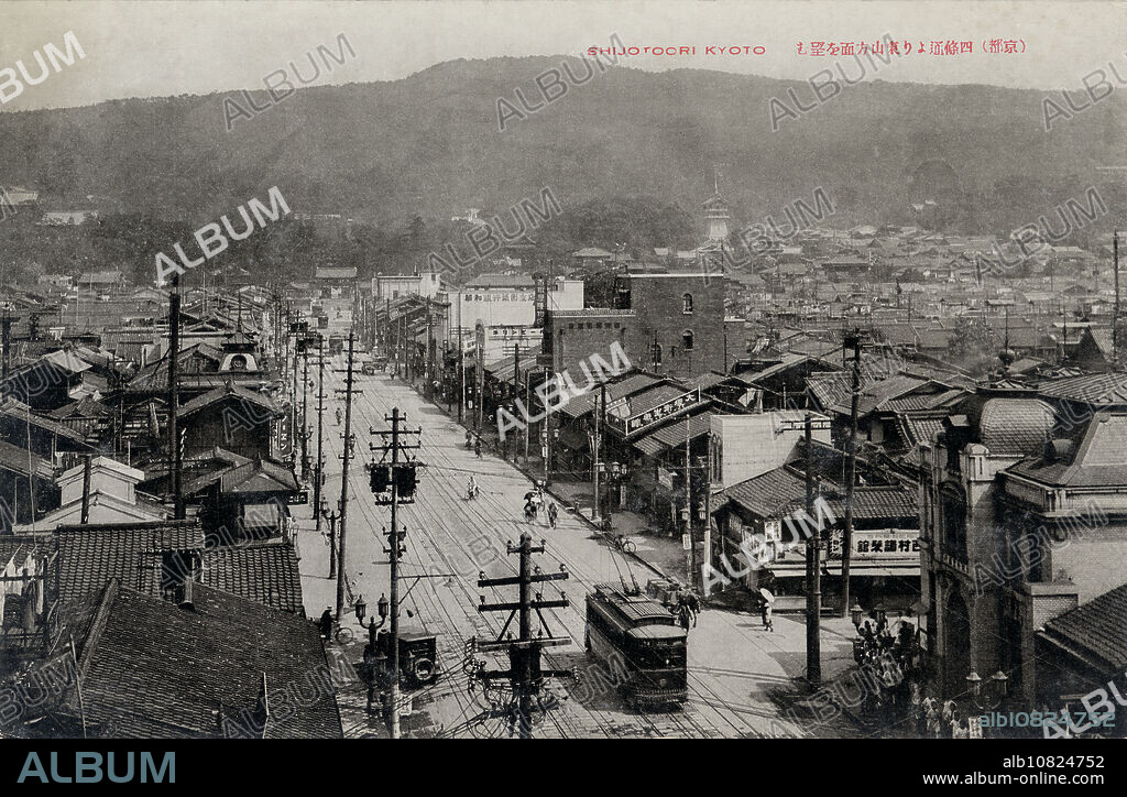 [ 1920s Japan - Shijo-dori, Kyoto ] A streetcar on Shijo-dori () in the entertainment district of Gion in Kyoto. In the back, the important Yasaka Shrine () and the Higashiyama () district, home of many temples and shrines, can be seen. On the right, stretches Gion's famed geisha district. 20th century vintage postcard.