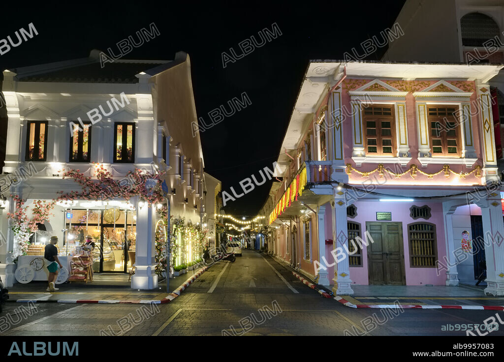 Thailand: Dusk falls over Thalang Road in the Old Town area of Phuket Town (Phuket City), Phuket, the road, with its numerous Sino-Portuguese style houses has become a major tourist attraction, with many of the houses converted into restaurants cafes and guest houses. Centre: Soi Rommanee, a lane once upon a time dominated by red-light establishments, mostly catering to tin mine workers, now prettily renovated and now a tourist draw.