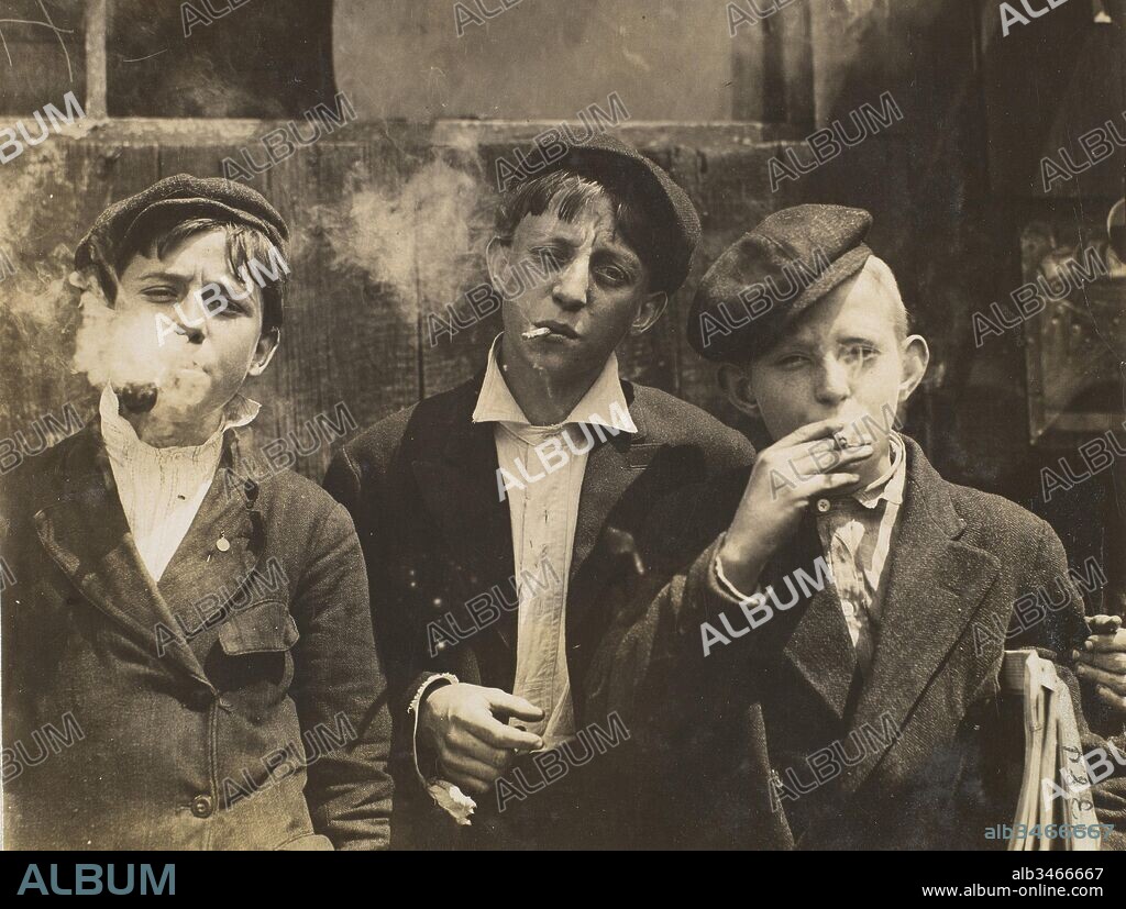 11:00 A.M. Monday, May 9th, 1910. Newsies at Skeeter's Branch, Jefferson near Franklin. They were all smoking. Location: St. Louis, Missouri., May 9, 1910, Gelatin silver print, 9.1 x 11.9 cm (3 9/16 x 4 11/16 in.), Photographs, Lewis Hine (American, 1874–1940), In 1908 Lewis Hine accepted a position as chief investigator and photographer for the National Child Labor Committee (NCLC), a private organization founded in 1904 to promote legislation to protect children from exploitation by American industry.