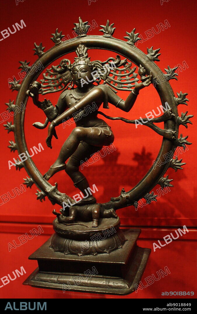Shiva Nataraja, Lord of the Dance, bronze, Vijayanagar, 1450-1500. Encircled by flames, Shiva as Cosmic Dancer dances the universe into being, sustains it with his rhythm and dances it back into annihilation. He holds a hand drum and a flame in his upper hands. His lower hands make the fear-dispelling gesture and point to his raised foot, the worship of which leads to salvation. His other foot bears down on the dwarf Apasmara who represents Maya or illusion.