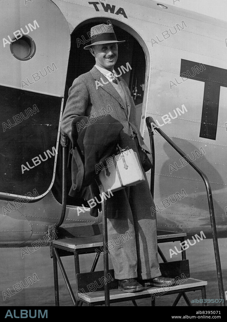 Pacific Flier Visits New York - Capt. P.G. Taylor, co-pilot to Sir Charles Kingsford-Smith in his recent Australia to California flight, is shown leaving a trans-Continental plane at Newark airport, Nov. 7 for a brief visit to New York.  November 07, 1934. (Photo by Associated Press Photo).