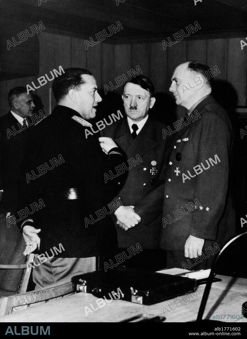 Adolf Hitler meeting Galeazzo Ciano. In the Wolf's Lair, German Headquarters, Fuhrer and Chancellor of Germany Adolf Hitler speaking with Italian Minister of Foreign Affairs Galeazzo Ciano, assisted by interpreter Paul Schmidt. Rastenburg, 18th December 1942.