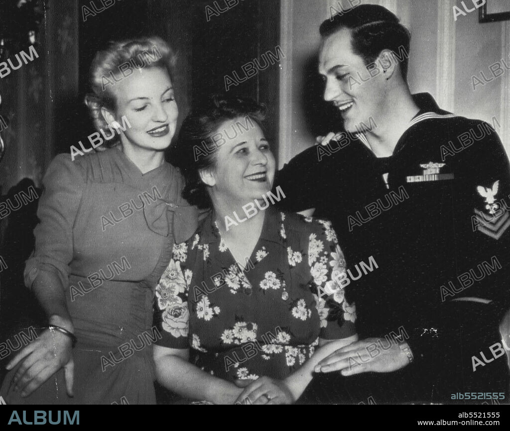 Australian War Bride, Sailor Returned -- Mrs. Eugene P. Pache, pretty 19-year-old Australian War Bride, was reunited with her husband, Navy Petty Officer first class, when she reached Buffalo this week. With them is the Sailor's mother, Mrs. Arnold J. Pache. April 27, 1944. (Photo by AP Wirephoto).